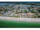 Aerial view of waterfront property featuring beach access, coastal buildings, and scenic waterways at 3 7Th Ave # 3, Indian Rocks Beach, FL 33785