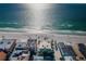 Stunning aerial shot of coastal buildings and beachfront showcasing the vibrant beach lifestyle and scenic ocean views at 3 7Th Ave # 3, Indian Rocks Beach, FL 33785