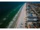 Stunning aerial view of the coastline with turquoise waters meeting the sandy beach and beachfront community at 3 7Th Ave # 3, Indian Rocks Beach, FL 33785