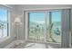Balcony view featuring a table and chairs, a white railing, and a scenic ocean view at 3 7Th Ave # 3, Indian Rocks Beach, FL 33785