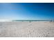 Wide, sun-kissed beach with calm waters, inviting residents and visitors to bask in the coastal ambiance and enjoy the scenery at 3 7Th Ave # 3, Indian Rocks Beach, FL 33785