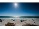 Sun-drenched beach with turquoise waters, a perfect spot for relaxation and recreation under the clear blue sky at 3 7Th Ave # 3, Indian Rocks Beach, FL 33785