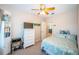 Bright bedroom with ceiling fan, seashell themed comforter, and white dresser at 3 7Th Ave # 3, Indian Rocks Beach, FL 33785