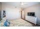 Comfortable bedroom with white dresser, television, and ample closet space at 3 7Th Ave # 3, Indian Rocks Beach, FL 33785