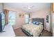 Cozy bedroom with natural light, ceiling fan, and neutral décor at 3 7Th Ave # 3, Indian Rocks Beach, FL 33785