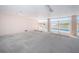 View of gated ground level parking showing assigned spaces and swimming pool access at 3 7Th Ave # 3, Indian Rocks Beach, FL 33785