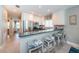 Kitchen with stainless appliances, granite countertops and bar stool seating at 3 7Th Ave # 3, Indian Rocks Beach, FL 33785