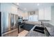 Modern kitchen featuring granite countertops, stainless steel appliances, and tiled backsplash at 3 7Th Ave # 3, Indian Rocks Beach, FL 33785