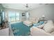 Bright living room with stunning ocean views, a cozy seating area, and beach-themed decor at 3 7Th Ave # 3, Indian Rocks Beach, FL 33785