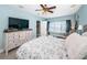 Cozy bedroom features a large TV, dresser, and a window offering beautiful ocean views at 3 7Th Ave # 3, Indian Rocks Beach, FL 33785