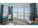 Well-lit office space boasts ocean views, desk, and a comfortable sitting area with spiral stairs at 3 7Th Ave # 3, Indian Rocks Beach, FL 33785