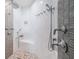 Walk-in shower featuring mosaic tile, multiple shower heads, built-in niche, and sleek design elements at 3 7Th Ave # 3, Indian Rocks Beach, FL 33785