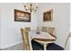 Cozy dining room features a round table set for intimate gatherings at 31 Island Way # 609, Clearwater Beach, FL 33767