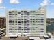Exterior of a high-rise condominium complex offering waterfront views and on-site parking at 31 Island Way # 609, Clearwater Beach, FL 33767