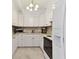 Bright kitchen featuring white cabinetry and updated appliances at 31 Island Way # 609, Clearwater Beach, FL 33767