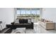Sun-lit living room featuring comfortable seating and water view at 31 Island Way # 609, Clearwater Beach, FL 33767