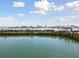 Scenic waterfront view featuring a bridge, city skyline, and lush green landscaping at 31 Island Way # 609, Clearwater Beach, FL 33767
