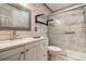 Bathroom with modern fixtures, stylish vanity, glass shower doors, and elegant marble tile at 3604 Brigadoon Cir # 3604, Clearwater, FL 33759