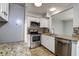Updated kitchen with granite countertops and stainless steel appliances at 3604 Brigadoon Cir # 3604, Clearwater, FL 33759