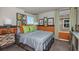 bedroom boasts playful decor, two large windows, comfortable furnishings and colorful accents at 37061 Sagemoor Dr, Zephyrhills, FL 33541