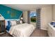 Bright bedroom with spirited decor, featuring a large window and comfortable furnishings, great for youth at 37061 Sagemoor Dr, Zephyrhills, FL 33541