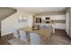 Bright, open-concept kitchen and dining room features modern appliances and a neutral color palette at 37061 Sagemoor Dr, Zephyrhills, FL 33541