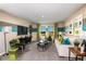 Well-lit living room with striped accent wall, modern furniture, and decor offering a comfortable and stylish space at 37061 Sagemoor Dr, Zephyrhills, FL 33541