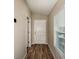 Hallway with wood-look floors and an exterior window at 37171 Sagemoor Dr, Zephyrhills, FL 33541