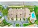 Scenic aerial view of the townhomes, highlighting proximity to the community pool and meticulously kept surroundings at 4212 Mill Valley Ct, Tampa, FL 33618
