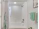 Clean white bathroom showcasing a shower/tub combo with white tile and a refreshing, bright ambiance at 4212 Mill Valley Ct, Tampa, FL 33618
