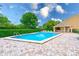 Sparkling community pool with a spacious deck area for lounging and a covered pavilion for shaded relaxation at 4212 Mill Valley Ct, Tampa, FL 33618