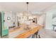 Dining area with a chandelier, tiled floor, and an open view of the kitchen at 4212 Mill Valley Ct, Tampa, FL 33618