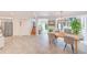 Open-concept dining area with tile floors, modern lighting, and access to the living room at 4212 Mill Valley Ct, Tampa, FL 33618