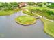 Scenic golf course showcasing a unique island green surrounded by water and lush landscaping at 4212 Mill Valley Ct, Tampa, FL 33618