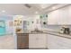 Stylish kitchen with stainless steel dishwasher, updated sink, and sleek countertops at 4212 Mill Valley Ct, Tampa, FL 33618