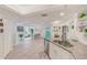 Open kitchen features modern appliances, gray countertops, and seamless transition into dining and living areas at 4212 Mill Valley Ct, Tampa, FL 33618