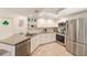 Updated kitchen featuring stainless steel appliances, sleek countertops, and white cabinetry at 4212 Mill Valley Ct, Tampa, FL 33618