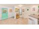 Bright kitchen with tile floors, white cabinets, and a serving counter at 4212 Mill Valley Ct, Tampa, FL 33618