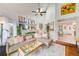 Open living room with vaulted ceilings, wood floors, eclectic decor, and natural light at 4212 Mill Valley Ct, Tampa, FL 33618