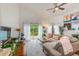 Inviting living room with wood floors, sliding glass doors, neutral furniture, and an area rug at 4212 Mill Valley Ct, Tampa, FL 33618