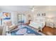 Spacious main bedroom offers wood floors, natural light, and serene decor for relaxation at 4212 Mill Valley Ct, Tampa, FL 33618