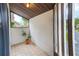 Enclosed porch featuring tile flooring, bright light and view to street and some landscape at 4212 Mill Valley Ct, Tampa, FL 33618