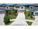 Overhead view of a landscaped property with a two-car garage and solar panels, nestled in a neighborhood at 4513 Eternal Prince Dr, Sun City Center, FL 33573