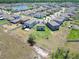 Aerial view of home in a beautiful community with a lake at 4513 Eternal Prince Dr, Sun City Center, FL 33573