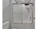 Bathroom featuring a white toilet and tub with sliding glass door, and tile walls at 4513 Eternal Prince Dr, Sun City Center, FL 33573
