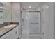 Bathroom showcases a granite countertop, sink, and glass-enclosed shower stall at 4513 Eternal Prince Dr, Sun City Center, FL 33573
