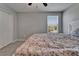 Cozy bedroom with a comfortable bed, window for natural light, and closet for storage at 4513 Eternal Prince Dr, Sun City Center, FL 33573