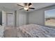 Comfortable bedroom featuring a window, closet, and access to another room at 4513 Eternal Prince Dr, Sun City Center, FL 33573
