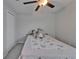 This bedroom features a closet, ceiling fan, and a cozy bed with a soft elephant at 4513 Eternal Prince Dr, Sun City Center, FL 33573