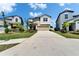 Charming two-story home with landscaped front yard and a spacious driveway at 4513 Eternal Prince Dr, Sun City Center, FL 33573